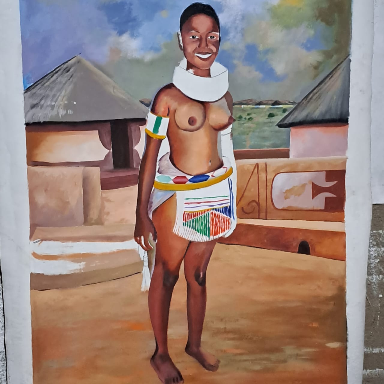 Bare breasted African girl 